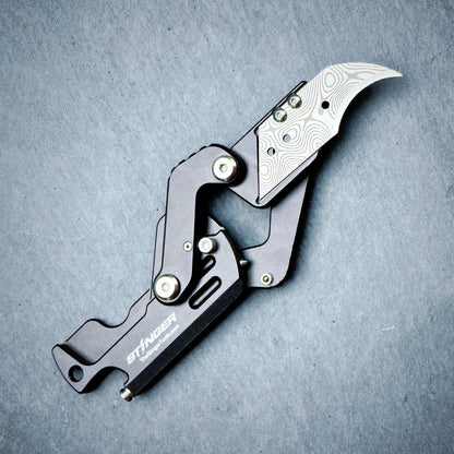 Stinger Dog Tag Tool matte black — folding blade deployed