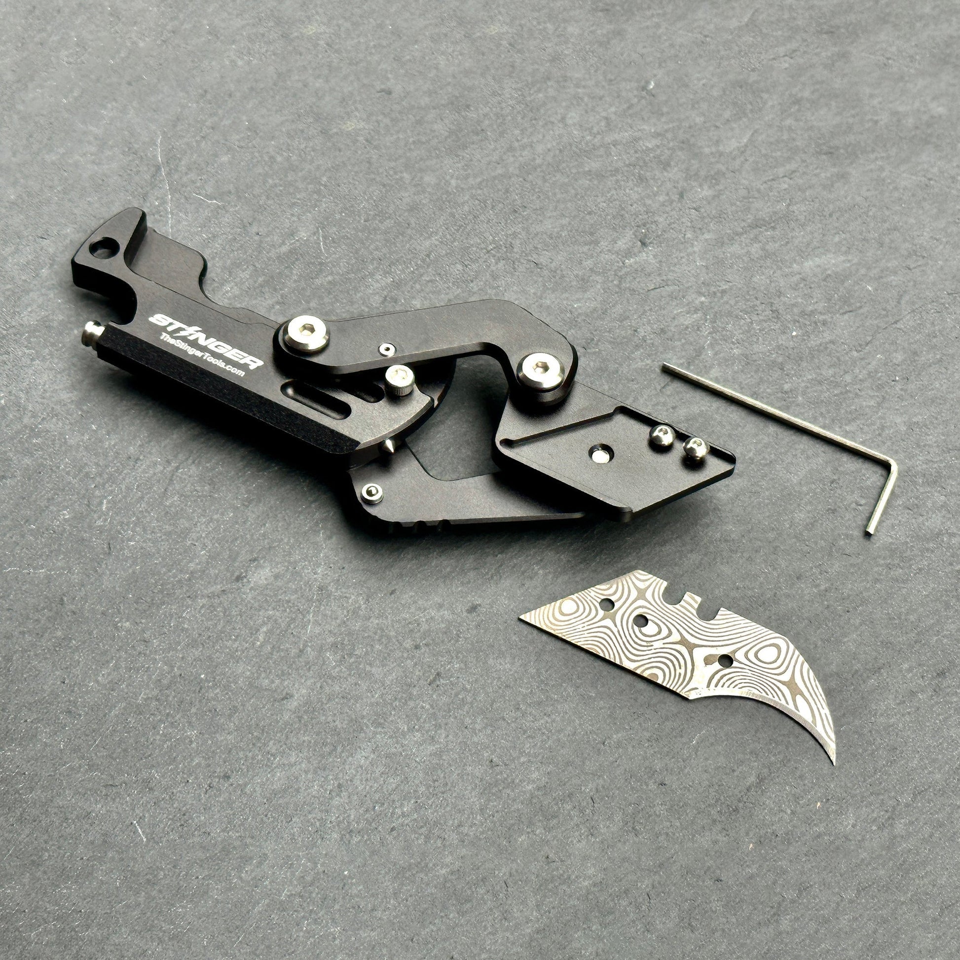 Stinger Dog Tag Tool — belt clip carry option